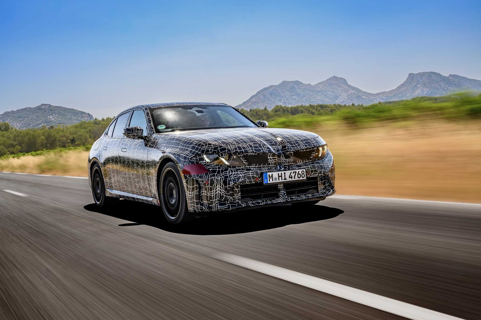 Camouflaged BMW 3 Series prototype driving at the Miramas proving ground