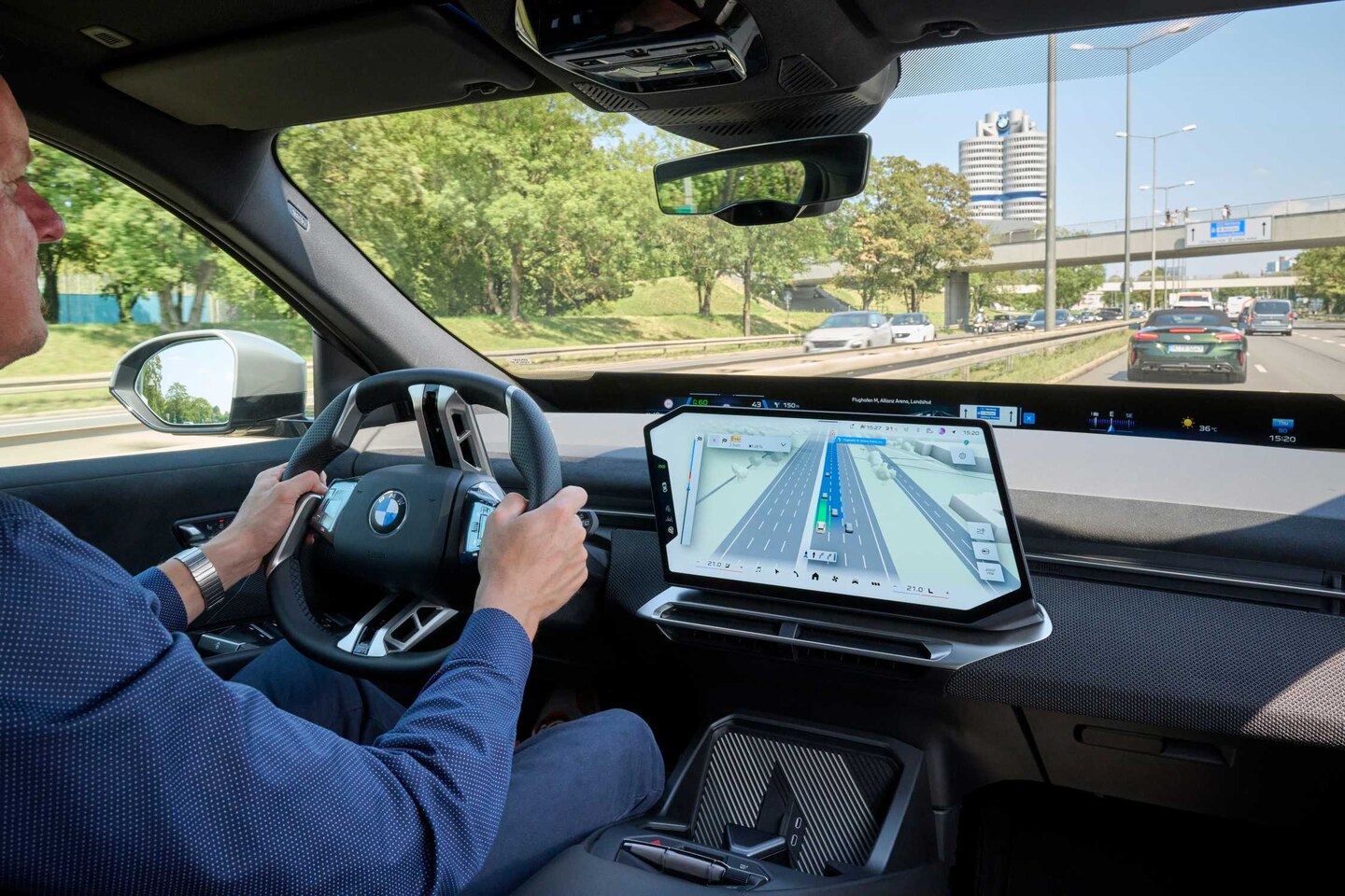 BMW-supplied image showing Maps navigation and driver-assistance information on a vehicle display.