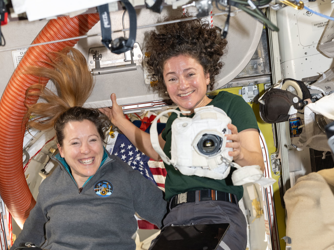 Expedition 75 crewmates Sophie Adenot and Jessica Meir inside the International Space Station